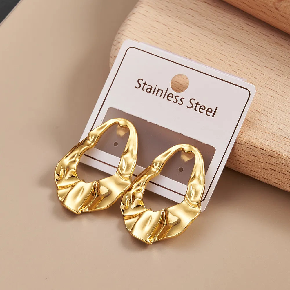 Sculpted Heart Form Gold Stud Earrings